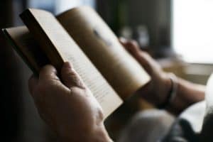 person reading, relaxing, destressing