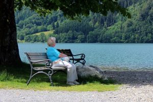 woman showing love to herself by taking time to notice nature