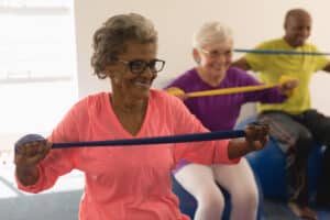 older people doing body awareness exercises