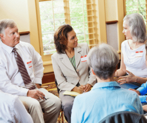 people sitting in a circle support group