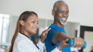 older adult with physical therapist